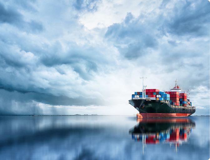 A freight ship with cloudy sky